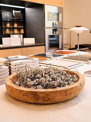 Modern interior with books and decorative bowl on table in showroom