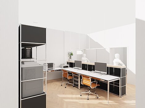 Modern office workspace with computers, orange chairs, and black shelving